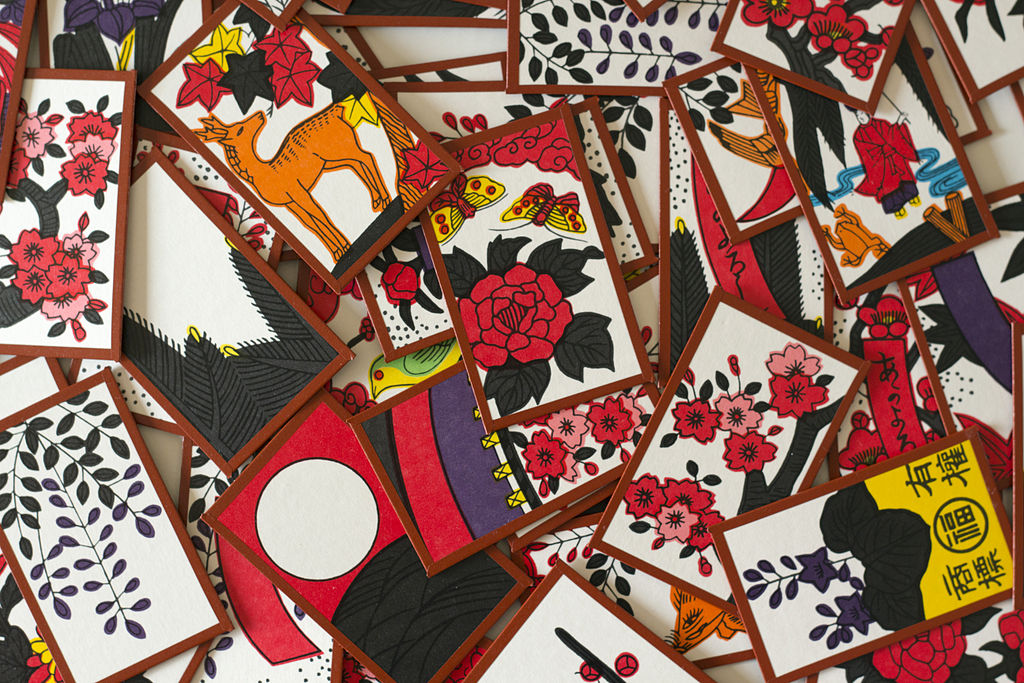 brightly coloured hanafuda cards spread out in a jumble
